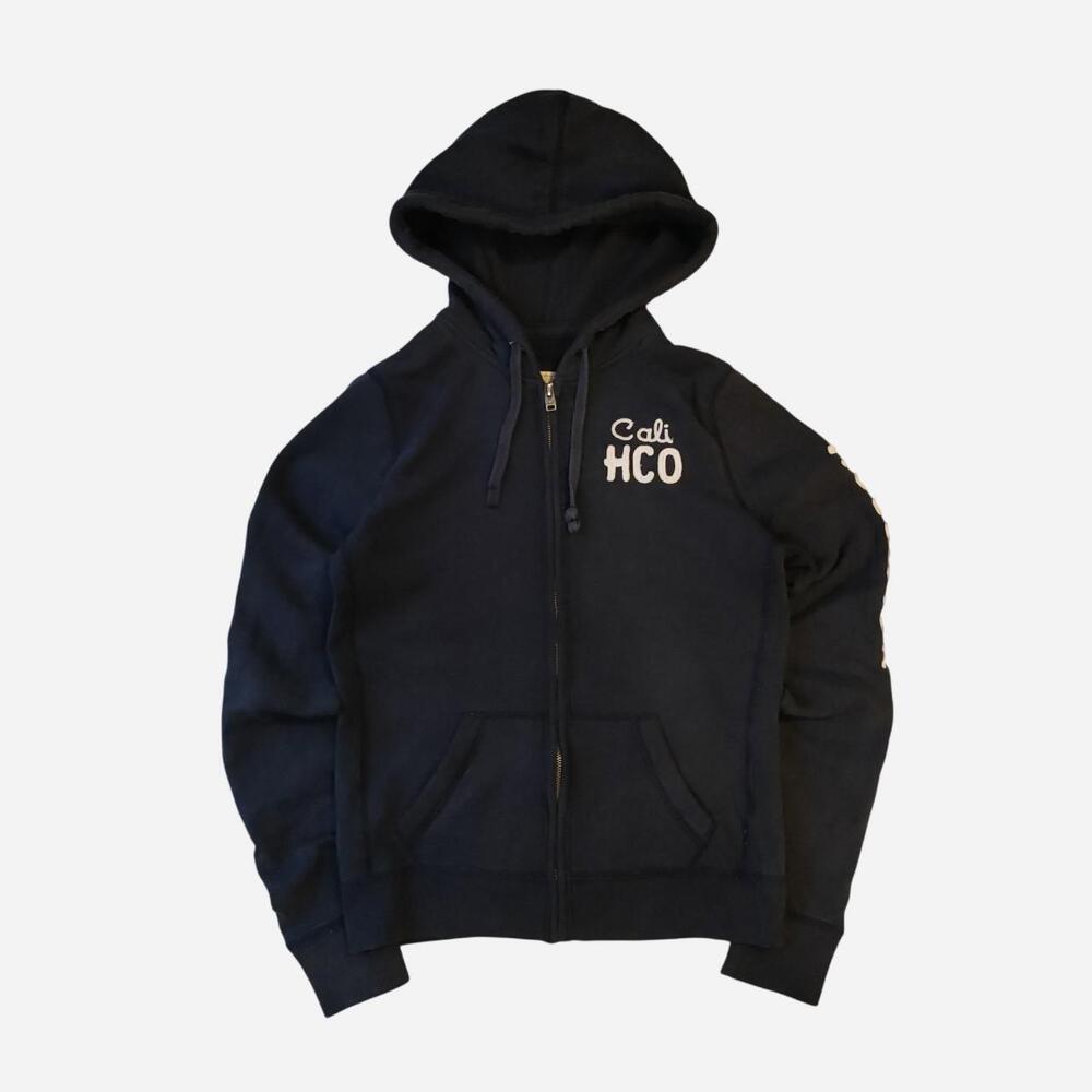 2000s Hollister Co. navy blue zip-up hoodie with white text reading 'Cali HCO' o